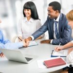 Business people shaking hands, finishing up a meeting