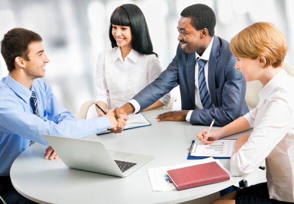 Business people shaking hands, finishing up a meeting